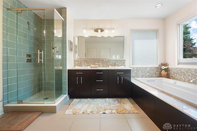 525 Heatherwoode Cir, Springboro, OH 45066 - full bath with a stall shower, vanity, a garden tub, and tile patterned flooring