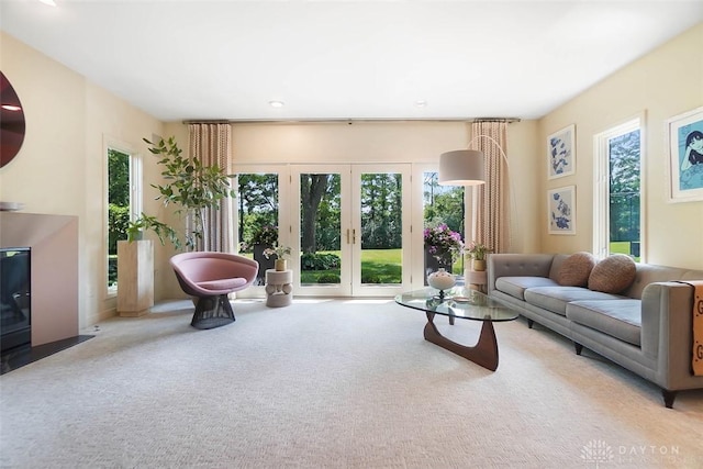 525 Heatherwoode Cir, Springboro, OH 45066 - living area with plenty of natural light, carpet floors, and french doors