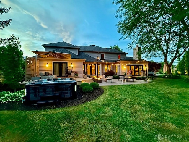 525 Heatherwoode Cir, Springboro, OH 45066 - back of property with a yard, a patio, a chimney, and french doors