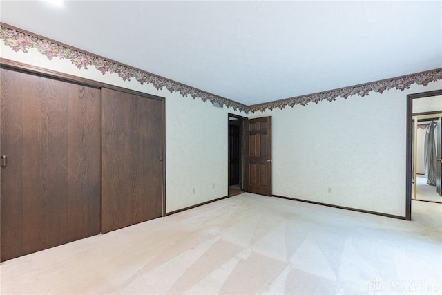 3072 Fowler Rd, Springfield, OH 45502 - unfurnished bedroom featuring a closet and light carpet