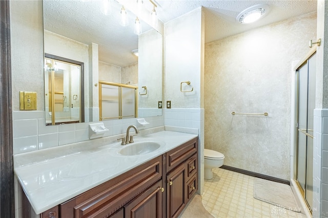 3072 Fowler Rd, Springfield, OH 45502 - full bathroom featuring vanity, a shower stall, a textured ceiling, and tile patterned floors