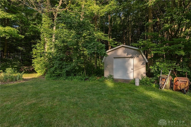 3072 Fowler Rd, Springfield, OH 45502 - view of grassy yard with a storage unit and a forest view