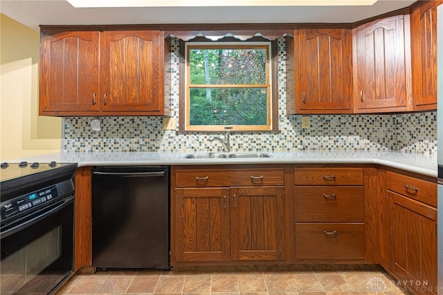 3072 Fowler Rd, Springfield, OH 45502 - kitchen with black appliances, light countertops, brown cabinetry, and tasteful backsplash