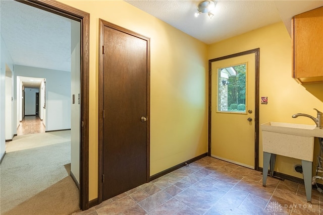 3072 Fowler Rd, Springfield, OH 45502 - washroom with a textured ceiling and baseboards