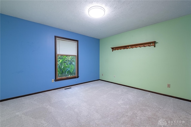 3072 Fowler Rd, Springfield, OH 45502 - carpeted spare room with a textured ceiling and baseboards