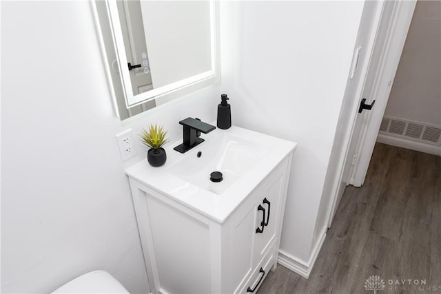 4651 Christopher Ave, Dayton, OH 45406 - bathroom with vanity and wood finished floors