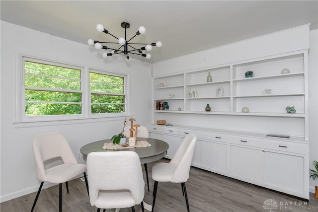 4651 Christopher Ave, Dayton, OH 45406 - dining space featuring a chandelier and wood finished floors
