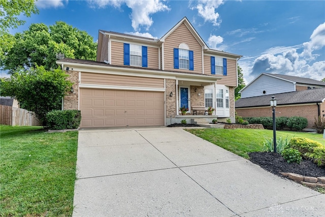 274 Tamarack Trl, Springboro, OH 45066 - traditional home featuring concrete driveway, brick siding, a garage, and covered porch