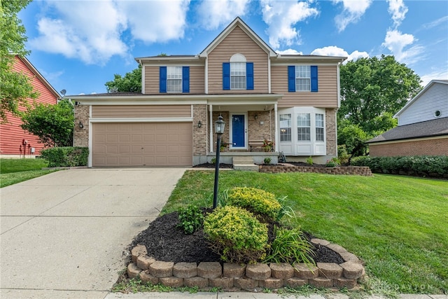 274 Tamarack Trl, Springboro, OH 45066 - traditional-style house featuring driveway, a front lawn, brick siding, and a garage