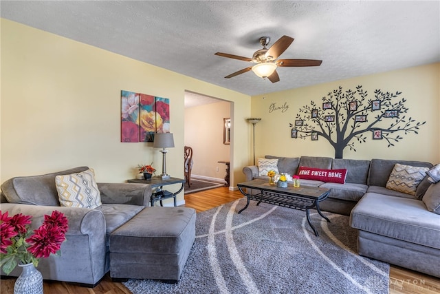 274 Tamarack Trl, Springboro, OH 45066 - living area with wood finished floors, a ceiling fan, and a textured ceiling