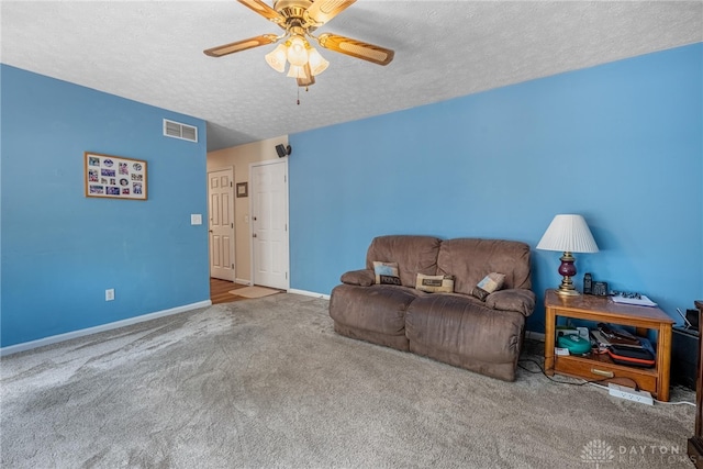 274 Tamarack Trl, Springboro, OH 45066 - carpeted living room featuring a ceiling fan and a textured ceiling