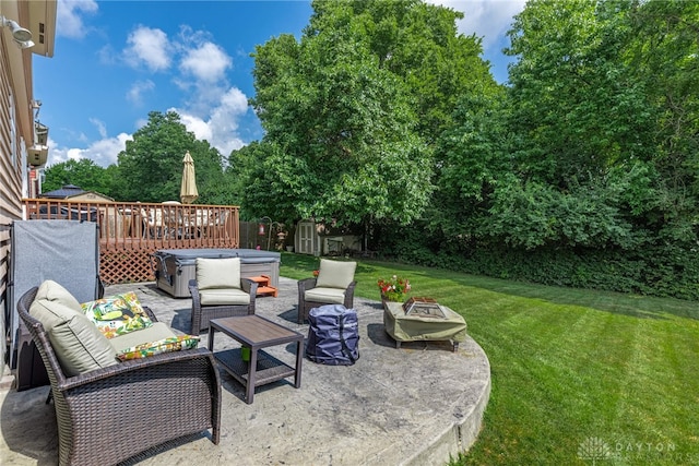 274 Tamarack Trl, Springboro, OH 45066 - view of patio with a shed, an outdoor living space with a fire pit, a hot tub, and a wooden deck