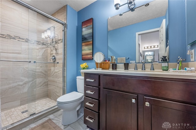 274 Tamarack Trl, Springboro, OH 45066 - bathroom featuring a shower stall, vanity, and a textured ceiling