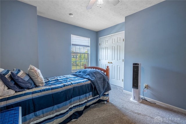 274 Tamarack Trl, Springboro, OH 45066 - carpeted bedroom with a textured ceiling, ceiling fan, and a closet