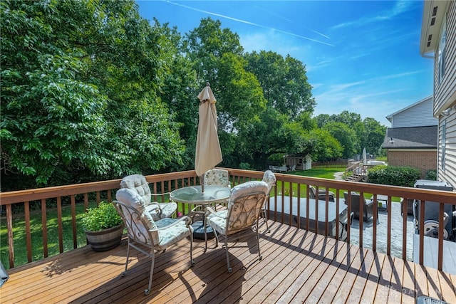 274 Tamarack Trl, Springboro, OH 45066 - wooden deck featuring outdoor dining space, a shed, and a yard