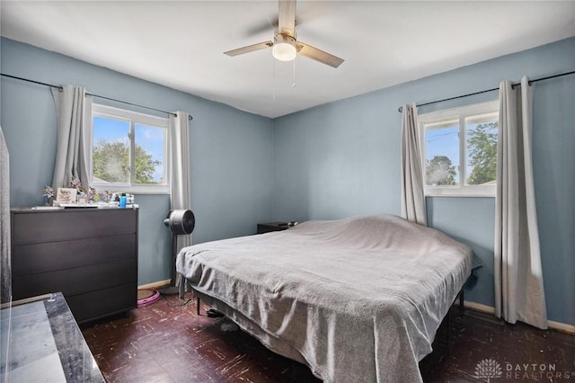 1220 Bookwalter Ave, New Carlisle, OH 45344 - bedroom featuring a ceiling fan and dark floors