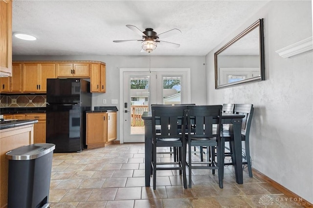 1220 Bookwalter Ave, New Carlisle, OH 45344 - dining room with a ceiling fan and a textured ceiling