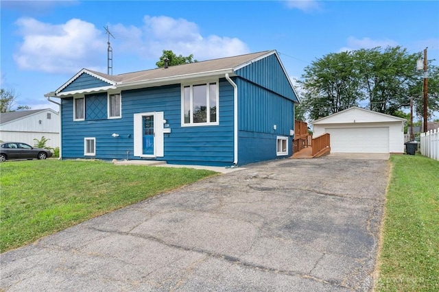 1220 Bookwalter Ave, New Carlisle, OH 45344 - view of front of property with an outbuilding, a front yard, and a garage