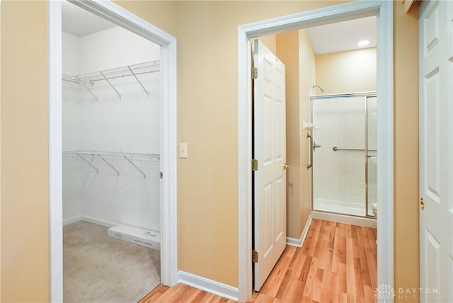 6963 Gentry Ln, Mason, OH 45040 - hallway with light wood-style floors and baseboards
