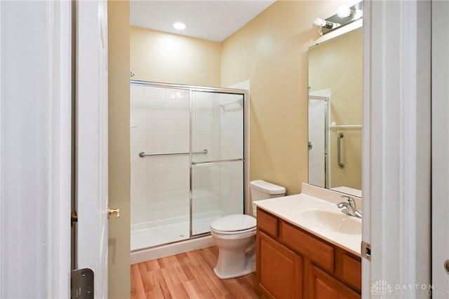 6963 Gentry Ln, Mason, OH 45040 - bathroom featuring wood finished floors, a shower stall, and vanity