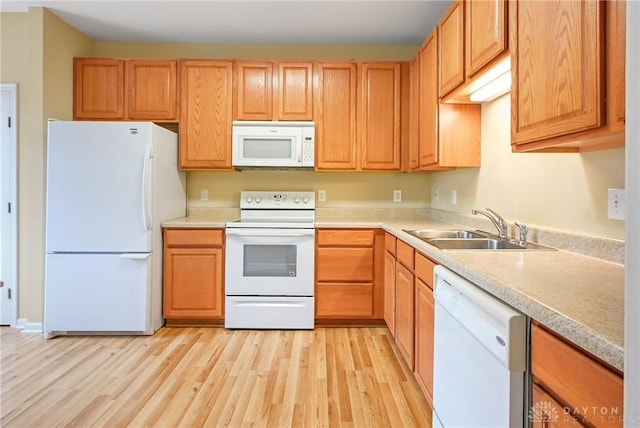 6963 Gentry Ln, Mason, OH 45040 - kitchen featuring white appliances, light wood-style floors, and light countertops