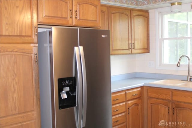 461 Poplar Grove Dr, Vandalia, OH 45377 - kitchen featuring stainless steel fridge with ice dispenser, light countertops, and brown cabinetry