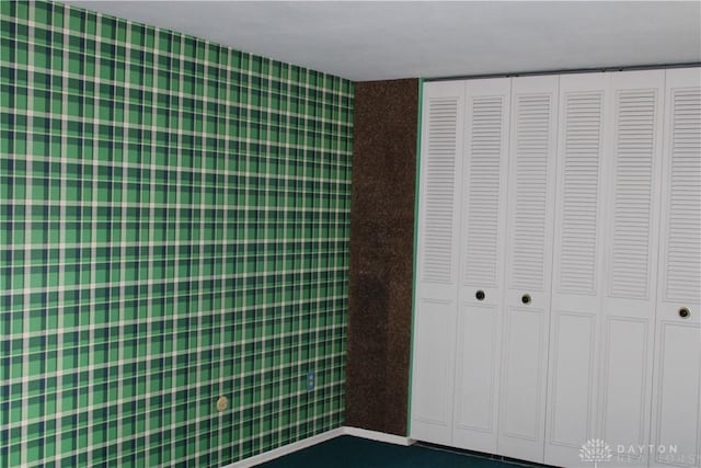 461 Poplar Grove Dr, Vandalia, OH 45377 - unfurnished bedroom with a closet and wallpapered walls