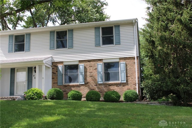 461 Poplar Grove Dr, Vandalia, OH 45377 - view of front of home with a front lawn and brick siding
