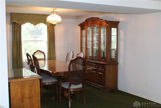 461 Poplar Grove Dr, Vandalia, OH 45377 - dining area featuring a chandelier, healthy amount of natural light, and dark carpet
