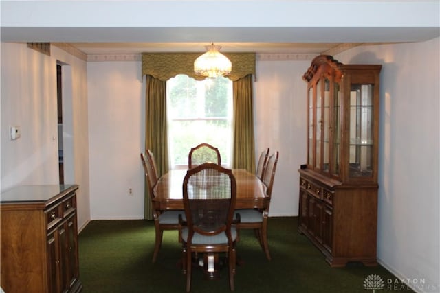 461 Poplar Grove Dr, Vandalia, OH 45377 - dining space with a chandelier and dark colored carpet