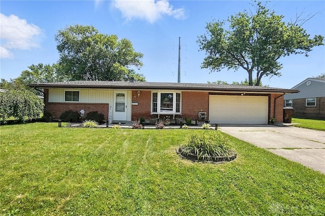 407 Overla Blvd, Englewood, OH 45322 - single story home with brick siding, driveway, a garage, and a front yard