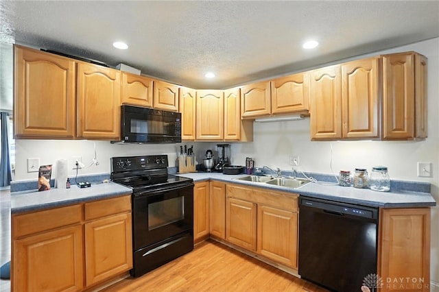 407 Overla Blvd, Englewood, OH 45322 - kitchen with black appliances, light wood-style floors, recessed lighting, and a textured ceiling