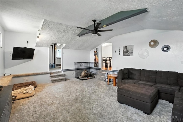 407 Overla Blvd, Englewood, OH 45322 - living room with a textured ceiling, vaulted ceiling, a ceiling fan, carpet flooring, and arched walkways