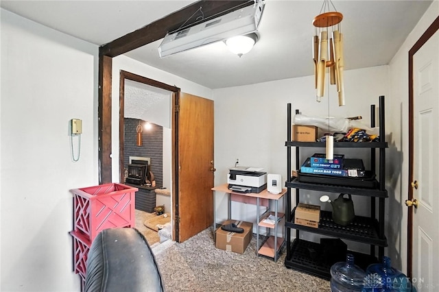 407 Overla Blvd, Englewood, OH 45322 - office area with a wood stove, carpet floors, and an AC wall unit