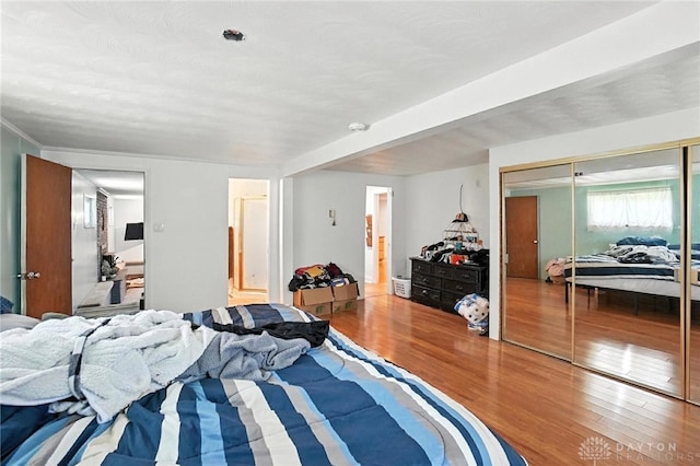 407 Overla Blvd, Englewood, OH 45322 - bedroom with wood finished floors, a closet, and ensuite bathroom