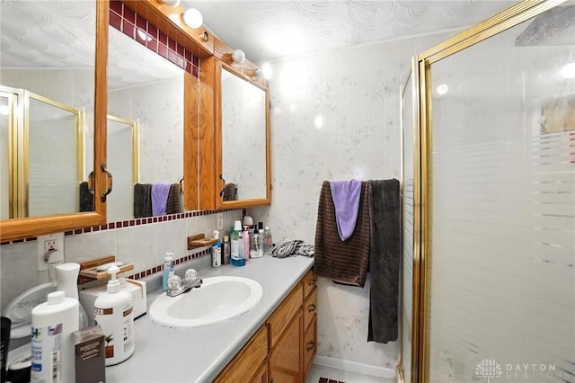 407 Overla Blvd, Englewood, OH 45322 - full bath featuring a shower stall, vanity, tile walls, and tasteful backsplash