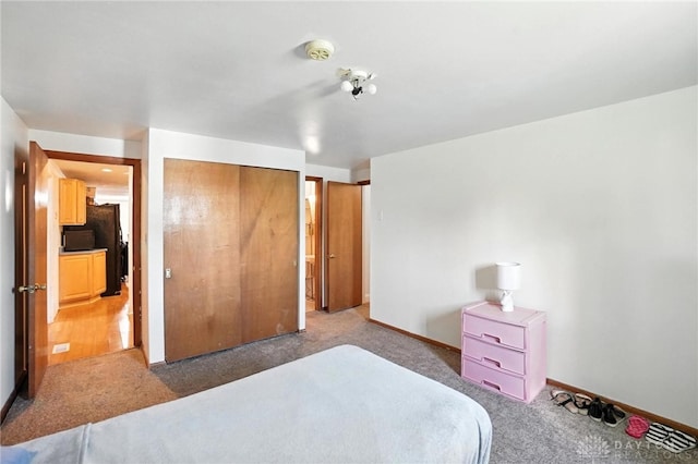 407 Overla Blvd, Englewood, OH 45322 - carpeted bedroom featuring a closet and freestanding refrigerator