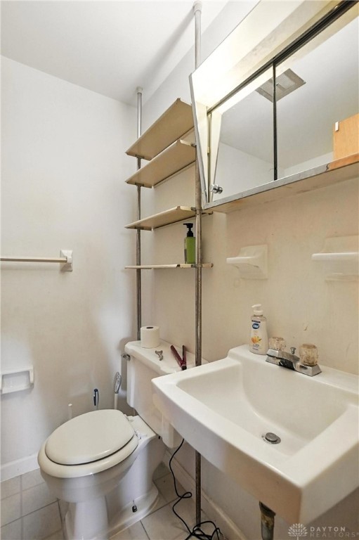 407 Overla Blvd, Englewood, OH 45322 - half bath featuring toilet and tile patterned floors