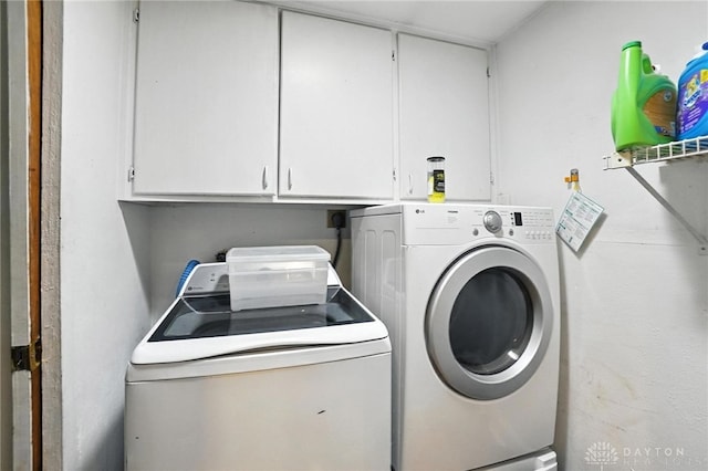 407 Overla Blvd, Englewood, OH 45322 - laundry area with washing machine and dryer and cabinet space