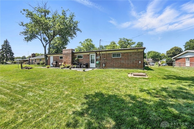 407 Overla Blvd, Englewood, OH 45322 - back of property featuring a patio and brick siding