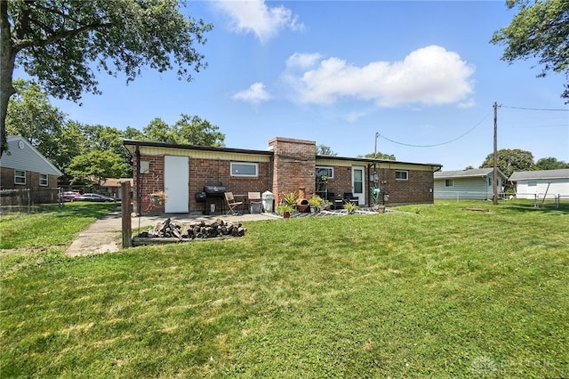 407 Overla Blvd, Englewood, OH 45322 - back of property featuring brick siding, a patio, and a chimney