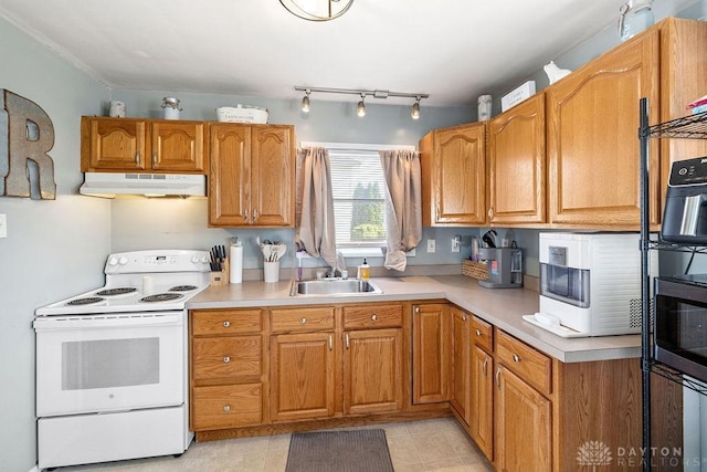 120 N Grant St, Covington, OH 45318 - kitchen featuring white range with electric cooktop, under cabinet range hood, light countertops, and stainless steel microwave