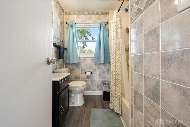120 N Grant St, Covington, OH 45318 - bathroom with tile walls, wood finished floors, and vanity
