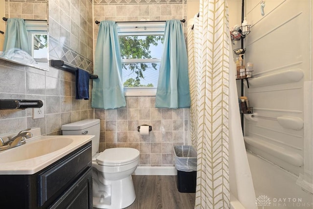 120 N Grant St, Covington, OH 45318 - full bathroom featuring tile walls, vanity, and wood finished floors