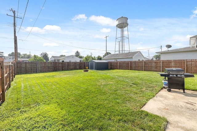 120 N Grant St, Covington, OH 45318 - fenced backyard featuring a storage shed and a patio area