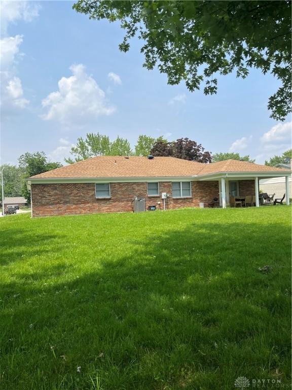 4220 Pleasanton Rd, Englewood, OH 45322 - rear view of house with a lawn