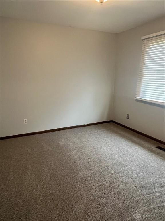 4220 Pleasanton Rd, Englewood, OH 45322 - carpeted spare room with baseboards