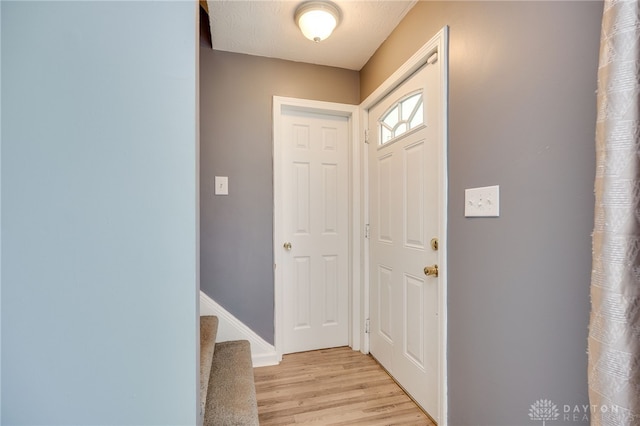 3521 E 4th St, Dayton, OH 45403 - foyer featuring light wood-style floors and stairway