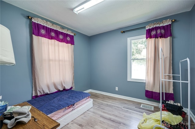 3521 E 4th St, Dayton, OH 45403 - bedroom featuring wood finished floors and baseboards