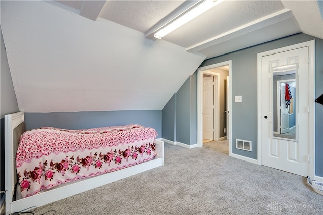 3521 E 4th St, Dayton, OH 45403 - bedroom with vaulted ceiling and carpet flooring